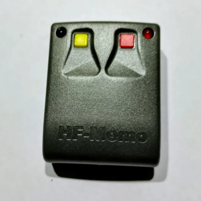 A dark grey two-button Bluetooth remote with the HF-Memo name embossed