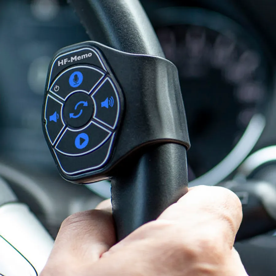 The HF-Memo remote attached to a steering wheel
